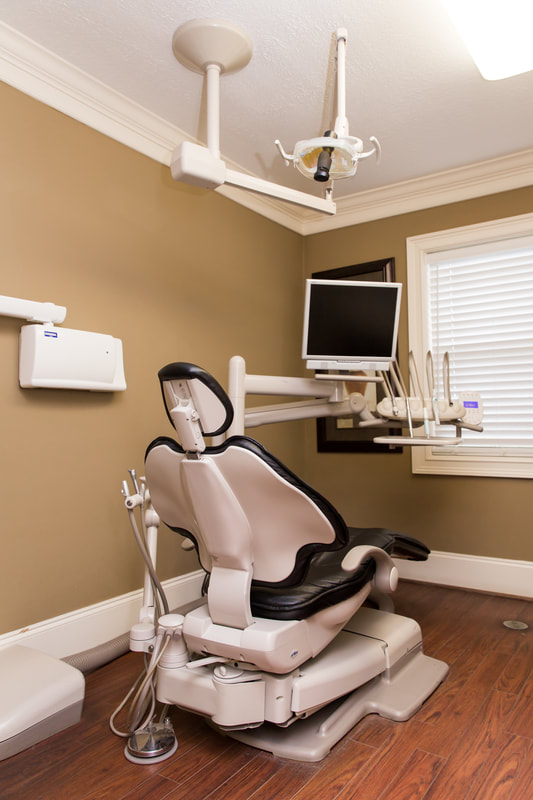 Comfortable patient treatment room with modern dental equipment